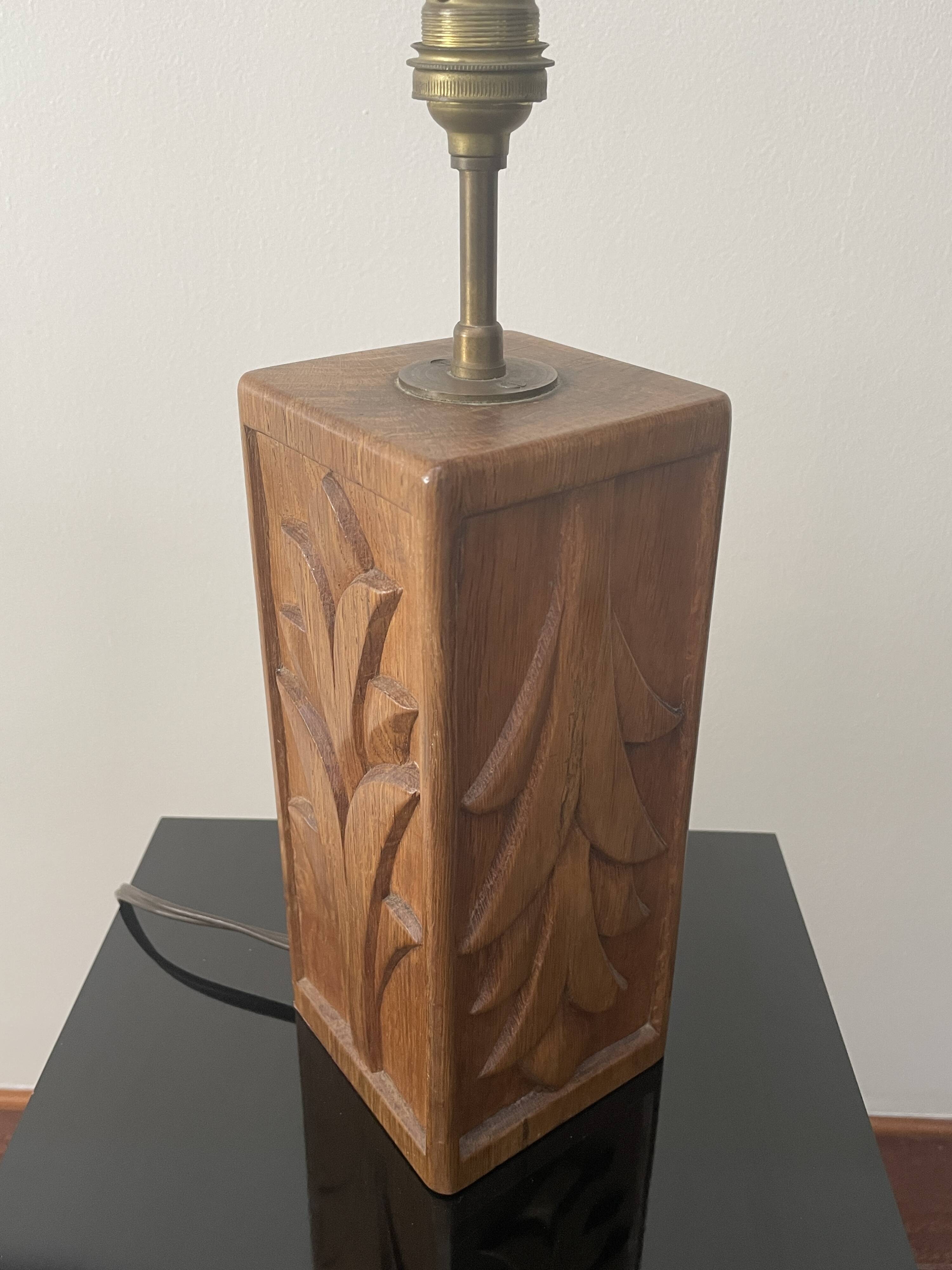 Wooden lamp with carved plant decoration from 1930-50, sold with a 1970 lampshade.