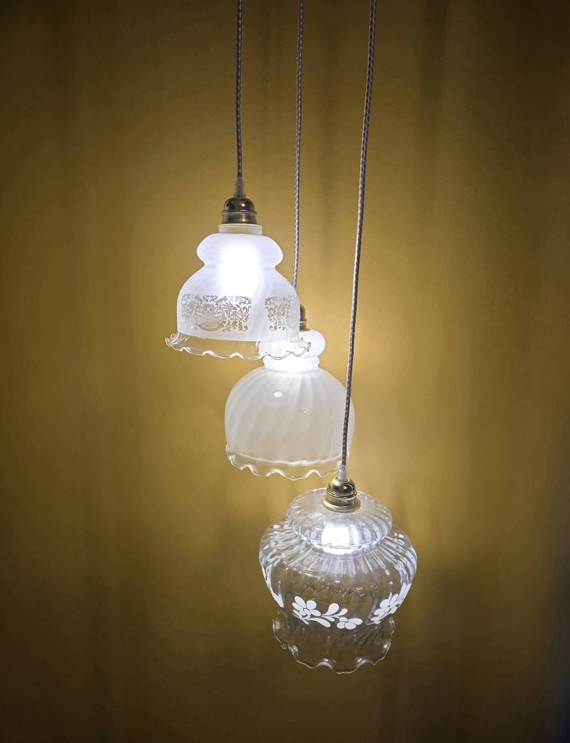 Original suspension of three vintage transparent glass globes.