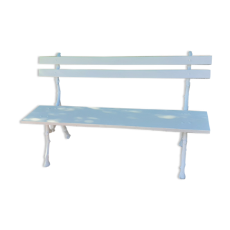 Old garden bench with cast iron feet and wooden planks