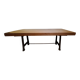 Industrial style table with a mahogany top.