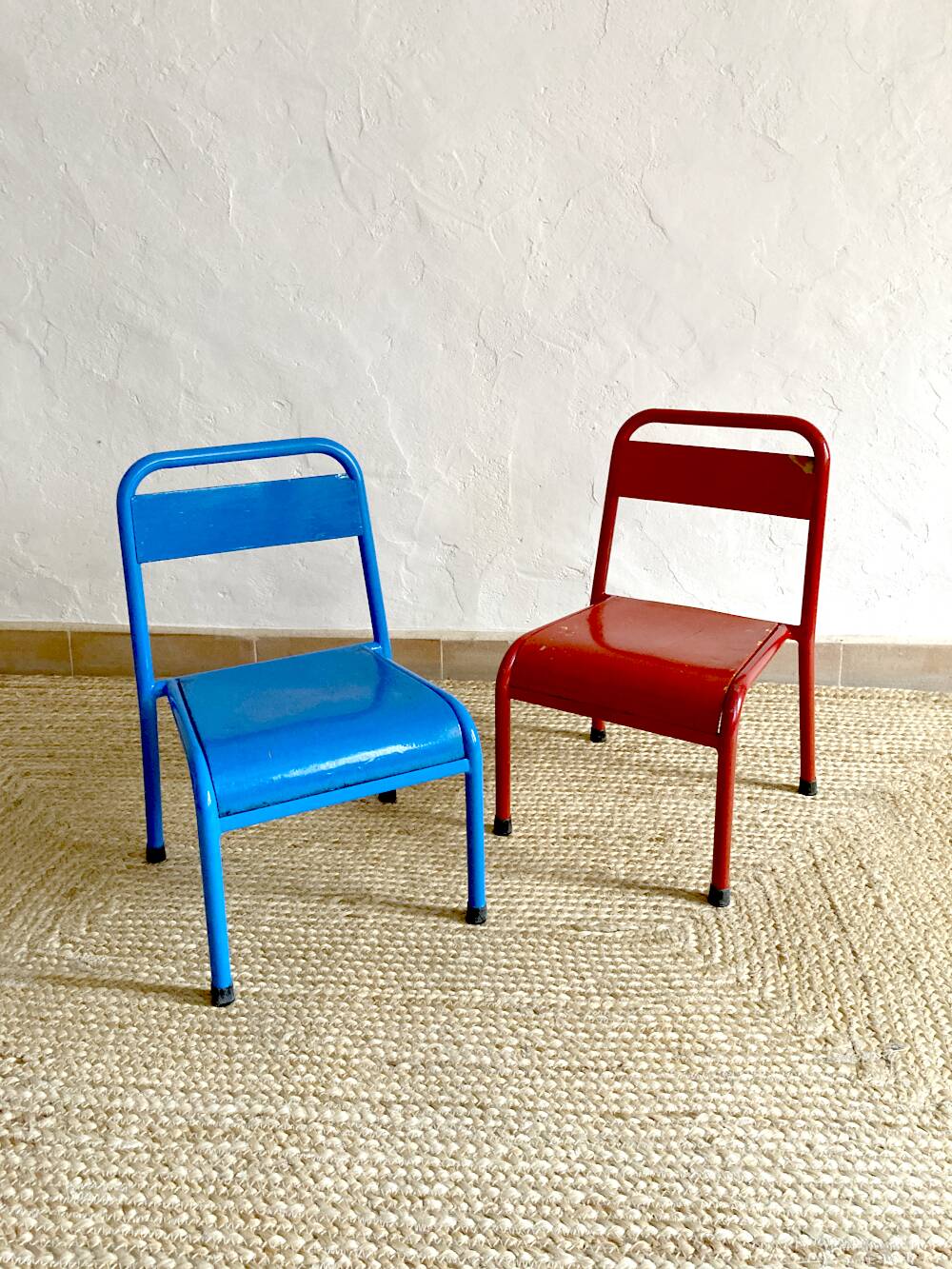 Pair of Mullca nursery chairs in metal and wood painted red and blue
