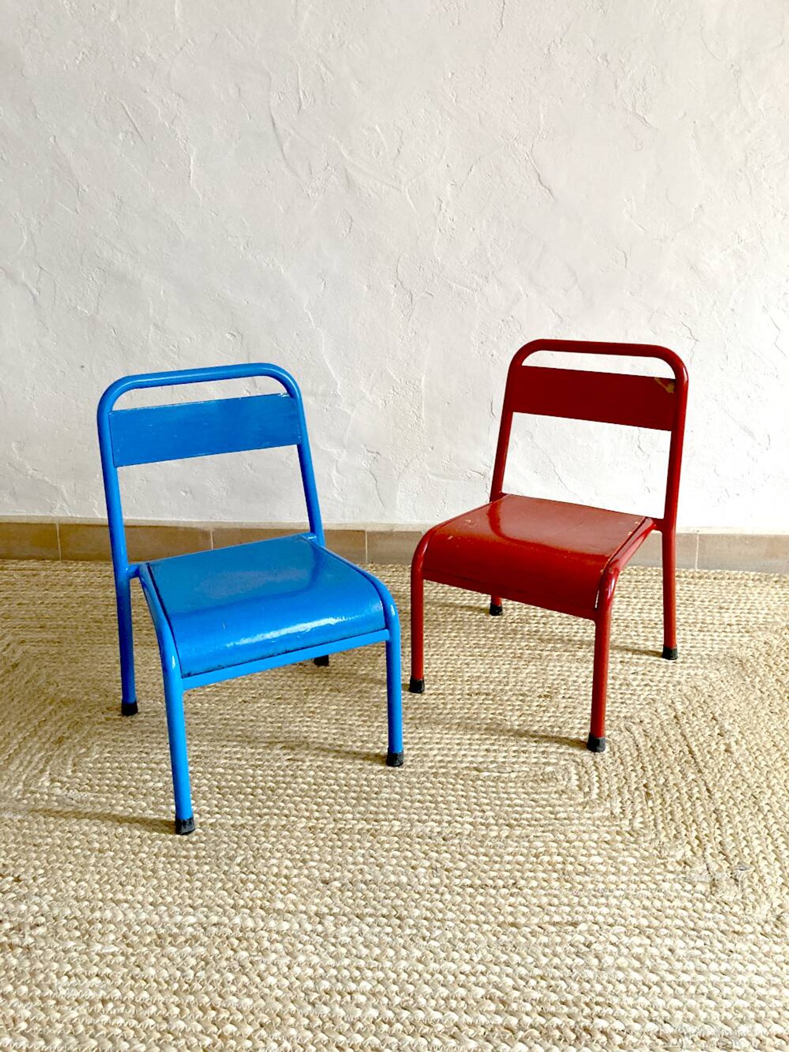 Pair of Mullca nursery chairs in metal and wood painted red and blue