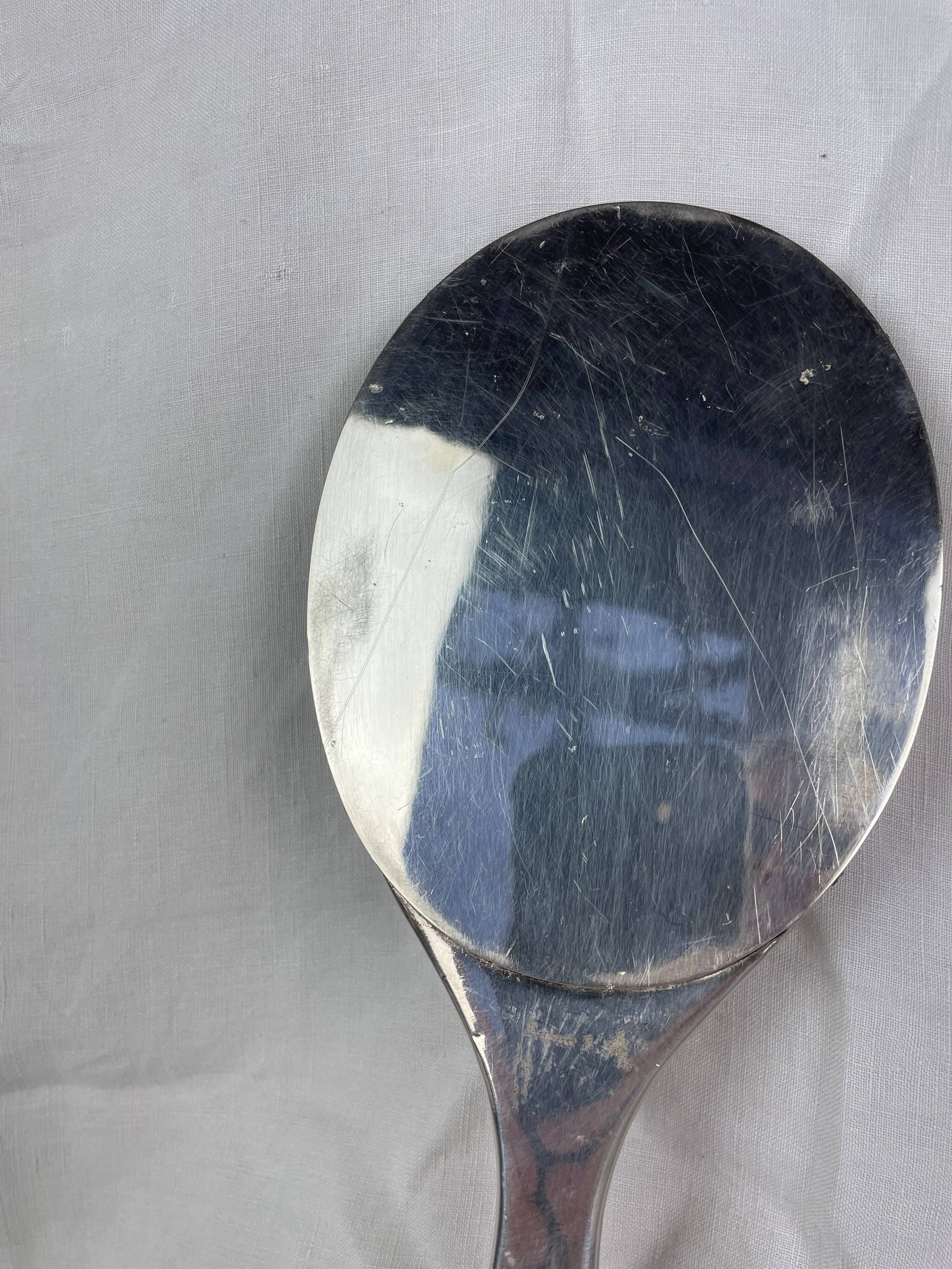 Silver metal hand mirror