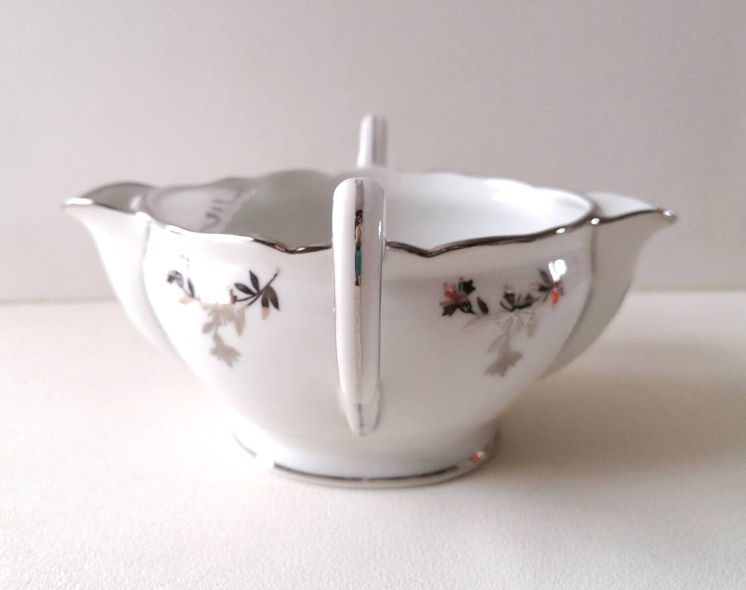 Limoges Maigre Gras porcelain sauce boat with silver decoration