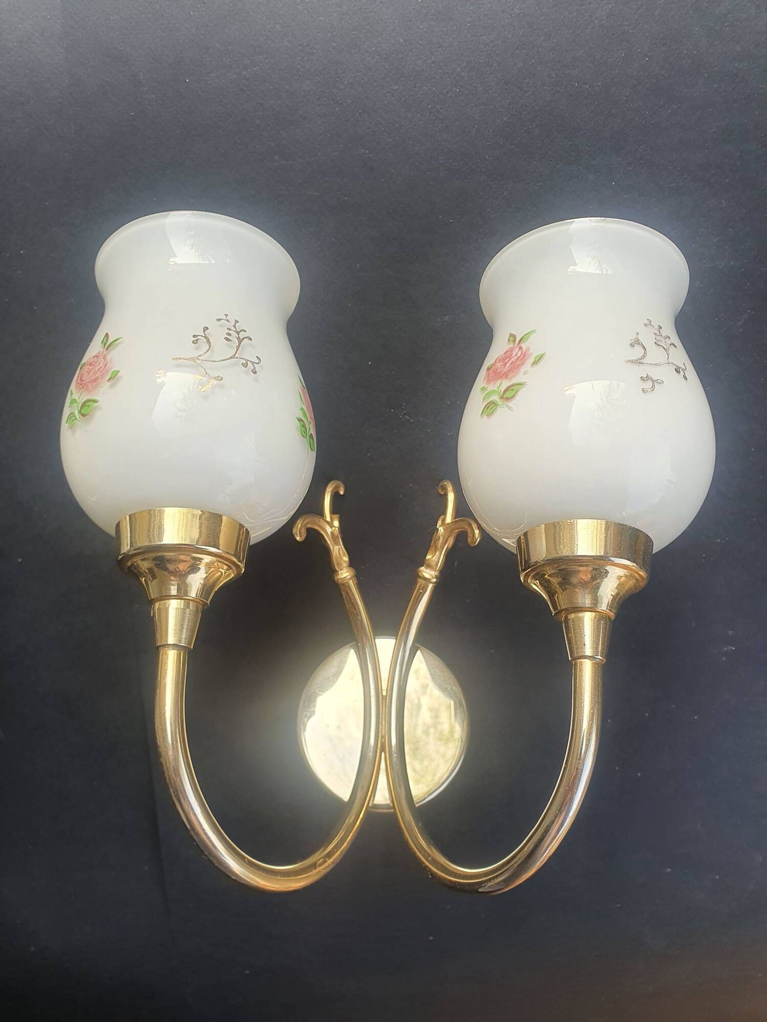 Pair of vintage wall sconces in gilded brass and pink opaline glass.