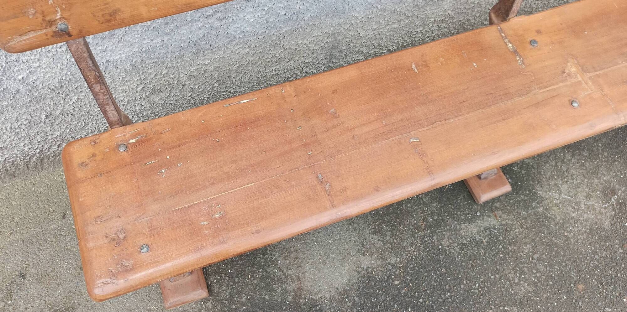 Old wooden bench with cast iron base