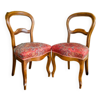 Pair of Louis Philippe chairs in 19th century re-upholstered walnut