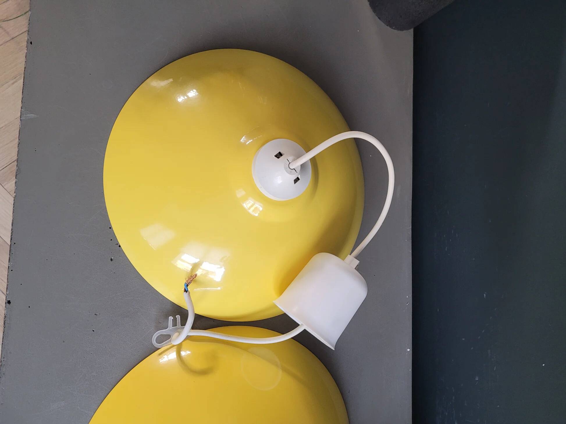 Pair of yellow lacquered metal pendant lights