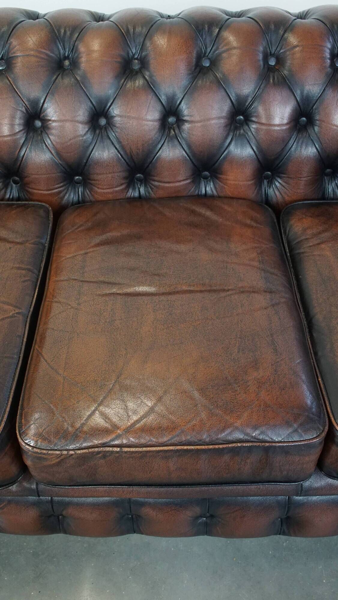 Classic English Chesterfield 2.5 seater sofa in brown cowhide