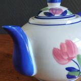 Antique teapot with flower pattern