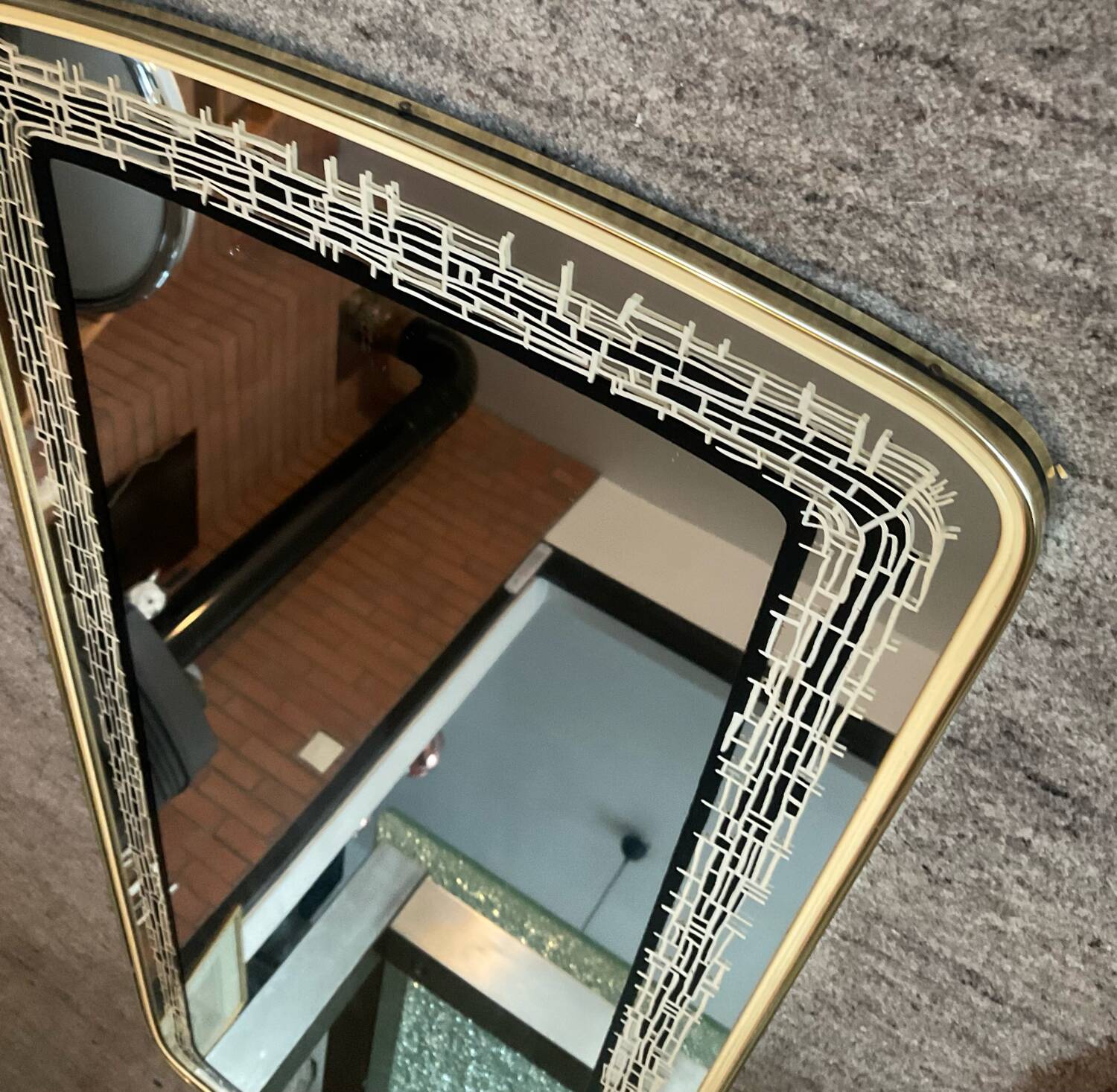 Asymmetrical free-form mirror from the 1970s