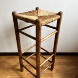 Low wooden and straw stool