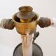 Wrought iron tripod floor lamp decorated with stylized animal heads