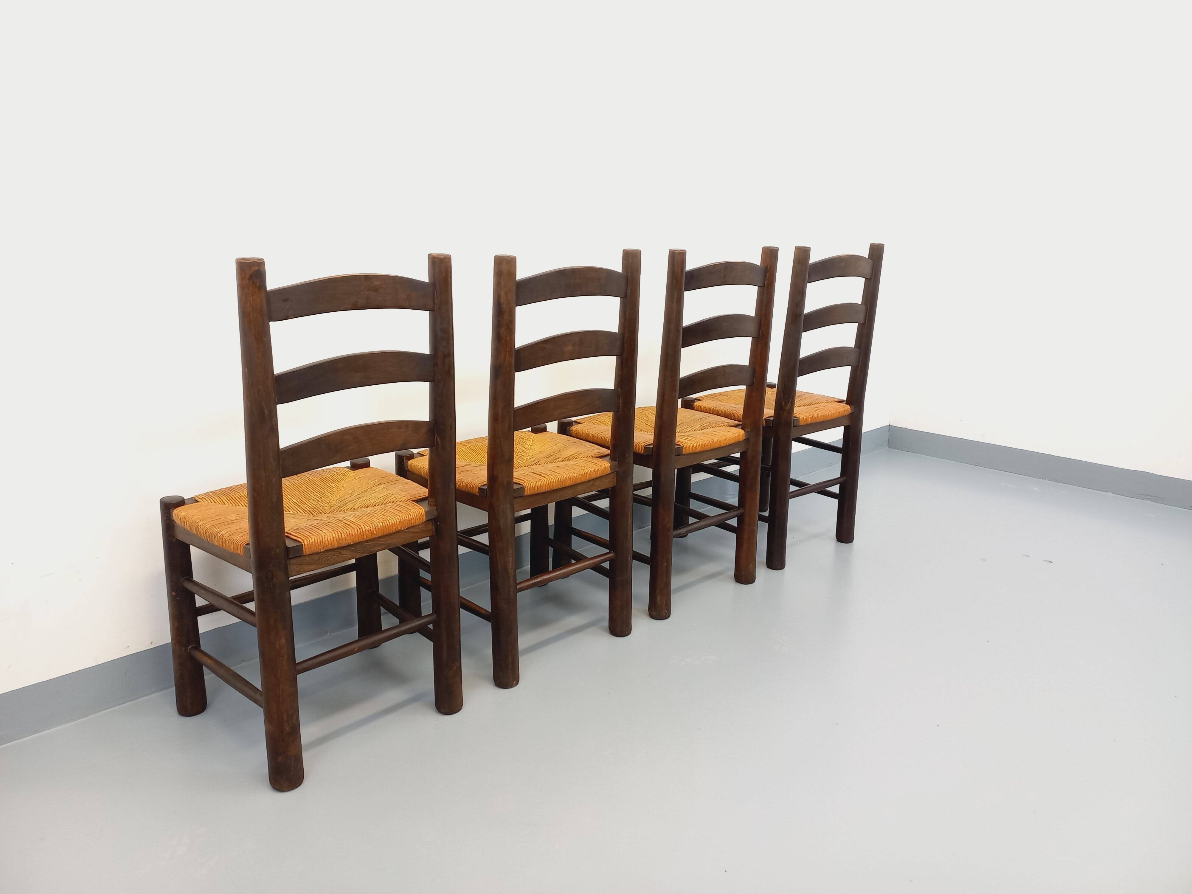 Set of 4 vintage brutalist chairs by Georges Robert in wood and straw.