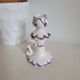 Ceramic candlestick with red and blue decoration.