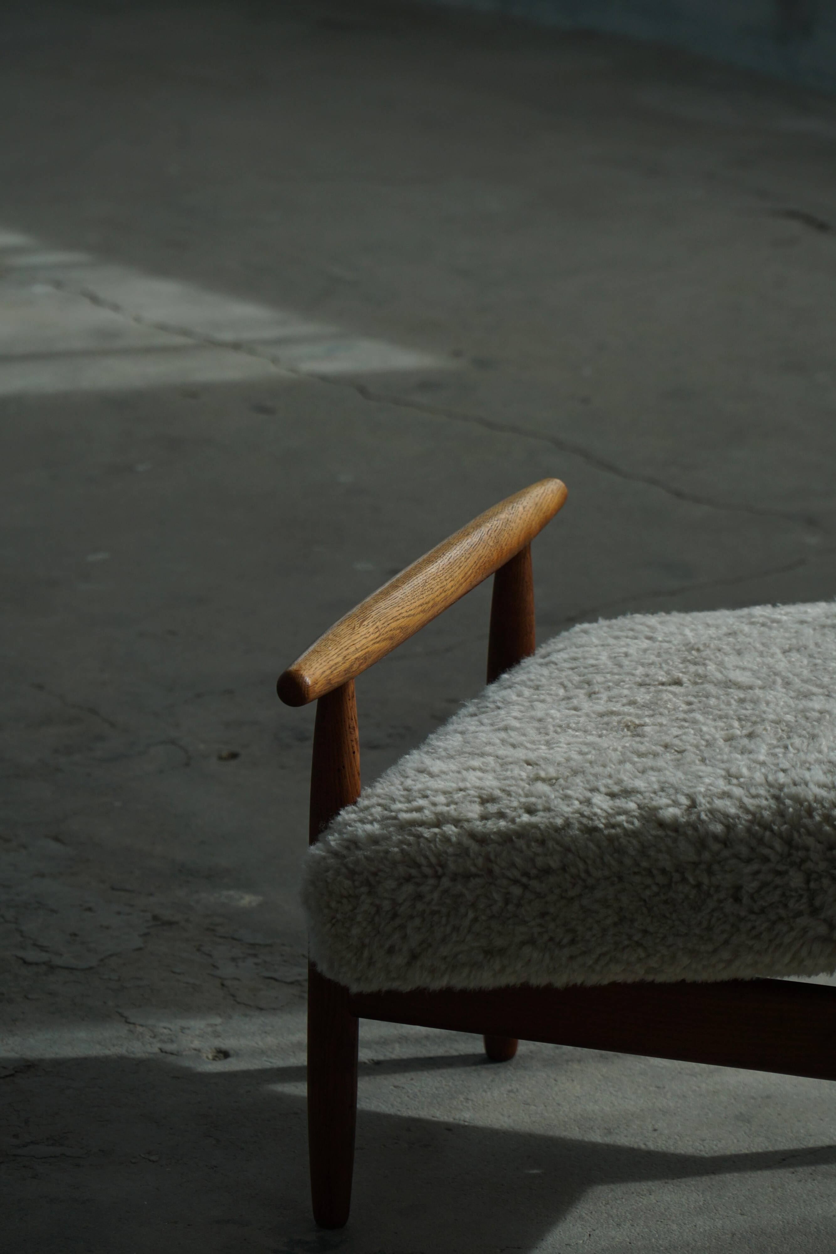 Eivind A. Johansen, oak footrest with light lambswool padding for FDB Møbler