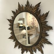 Sun mirror decorated with golden leaves, circa 1950.