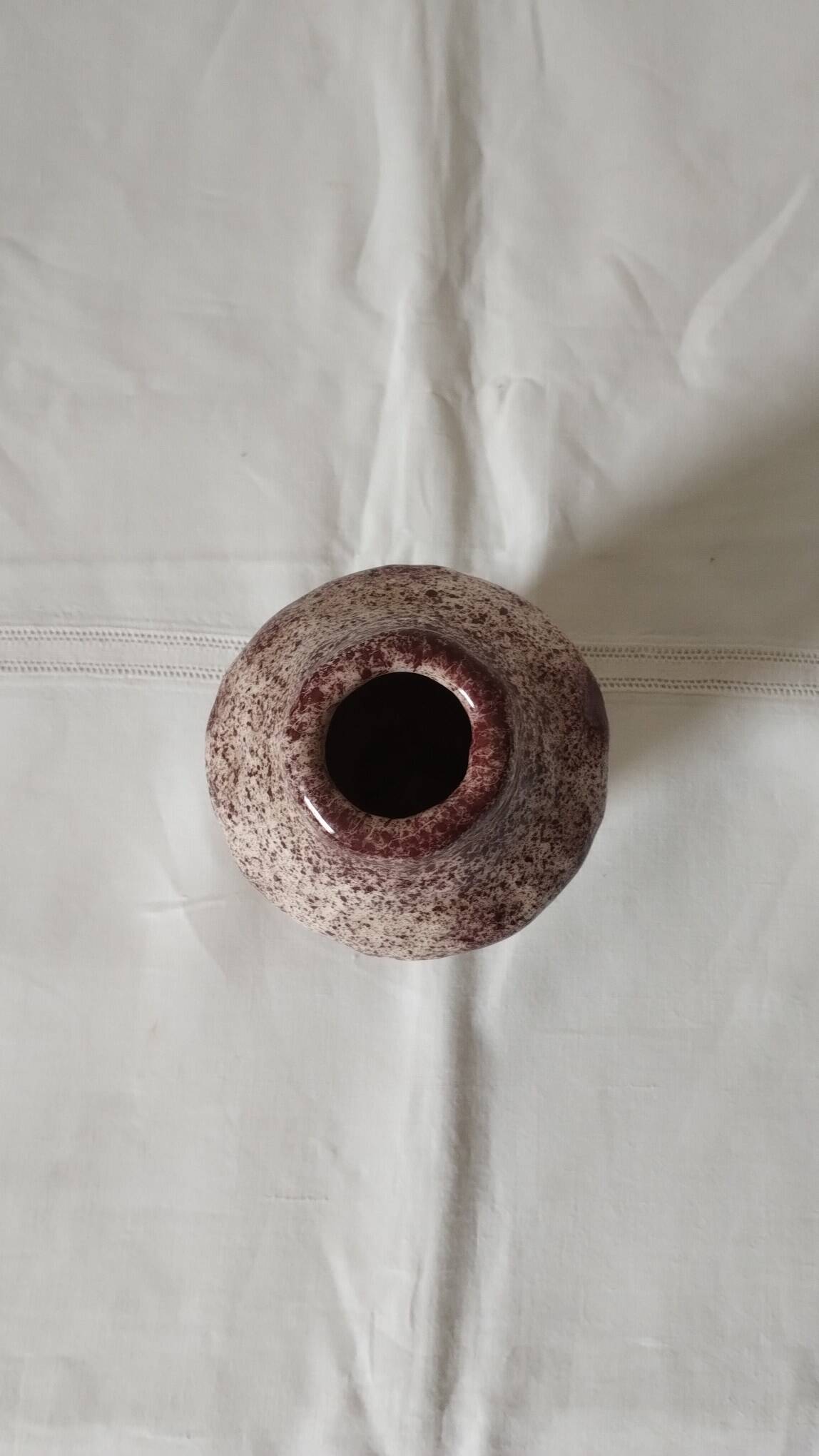 White ceramic vase with brown speckles