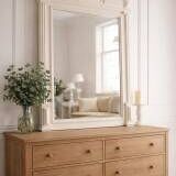 Antique bevelled mirror, frame in pearl grey patinated wood.