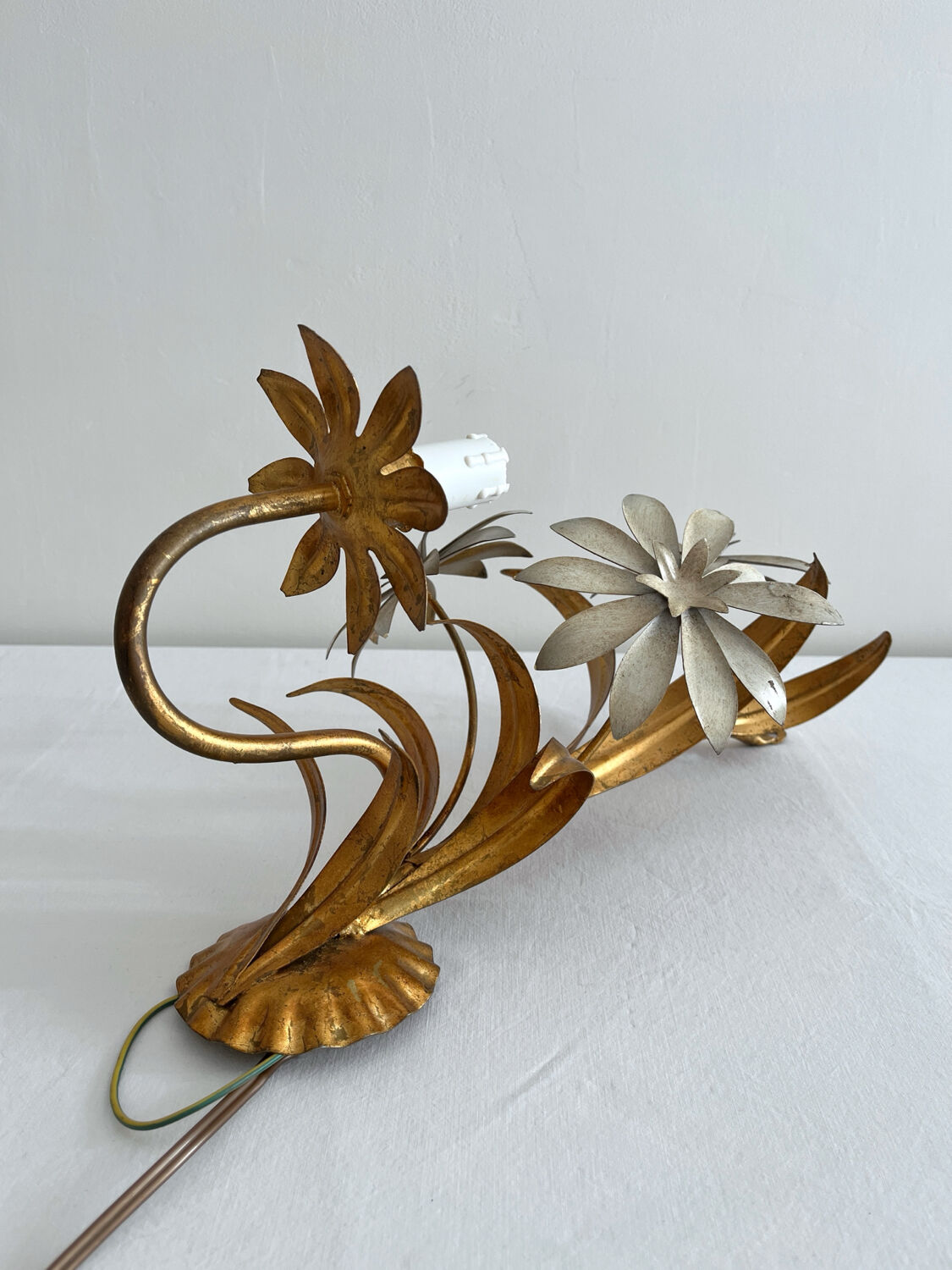 Vintage Hollywood Regency gold metal leaf wall sconce.