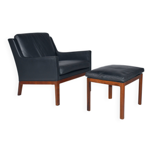 Fauteuil en cuir et repose-pieds