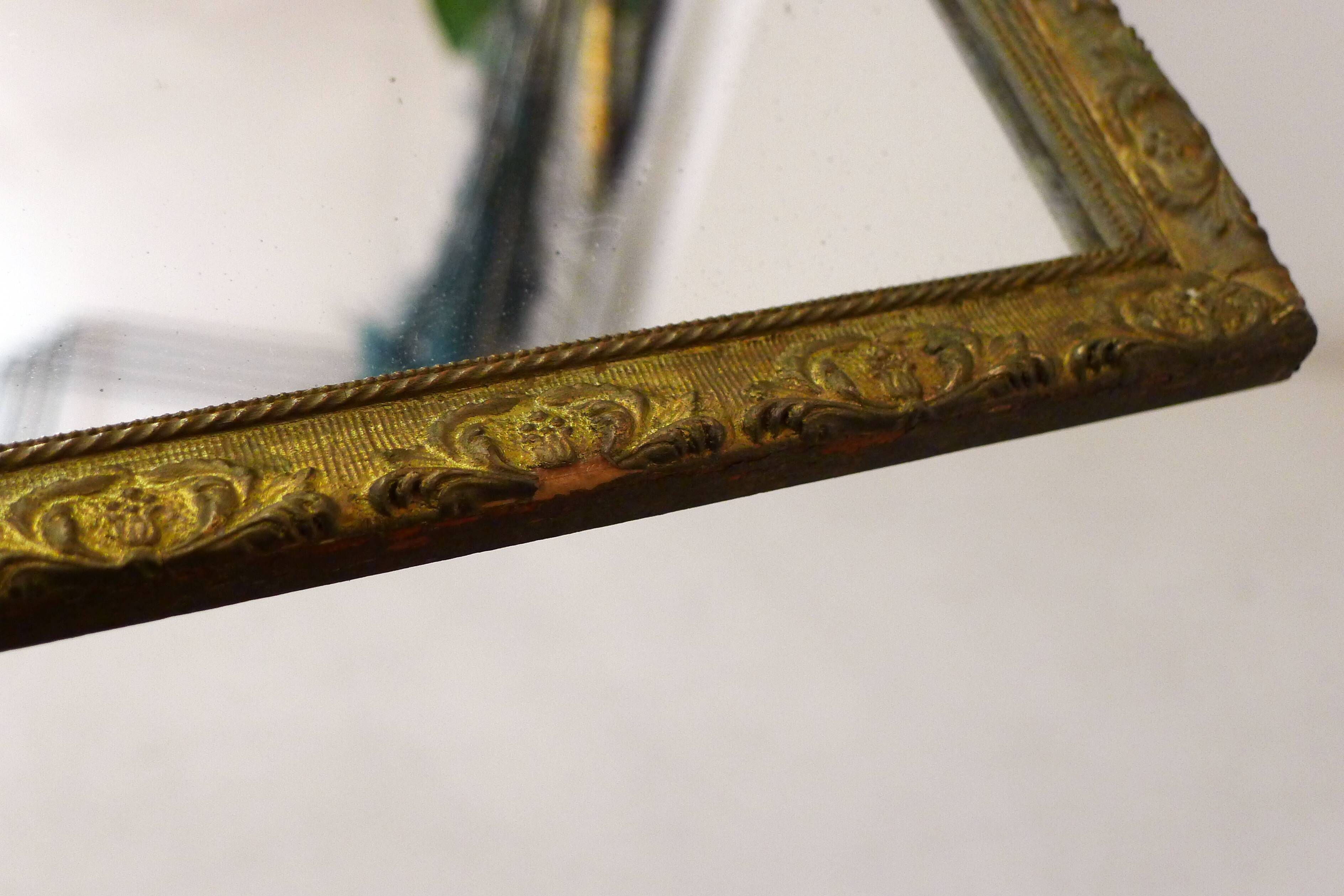 Large elongated gilded mirror