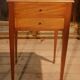 Nightstand with veneer and 4 drawers.