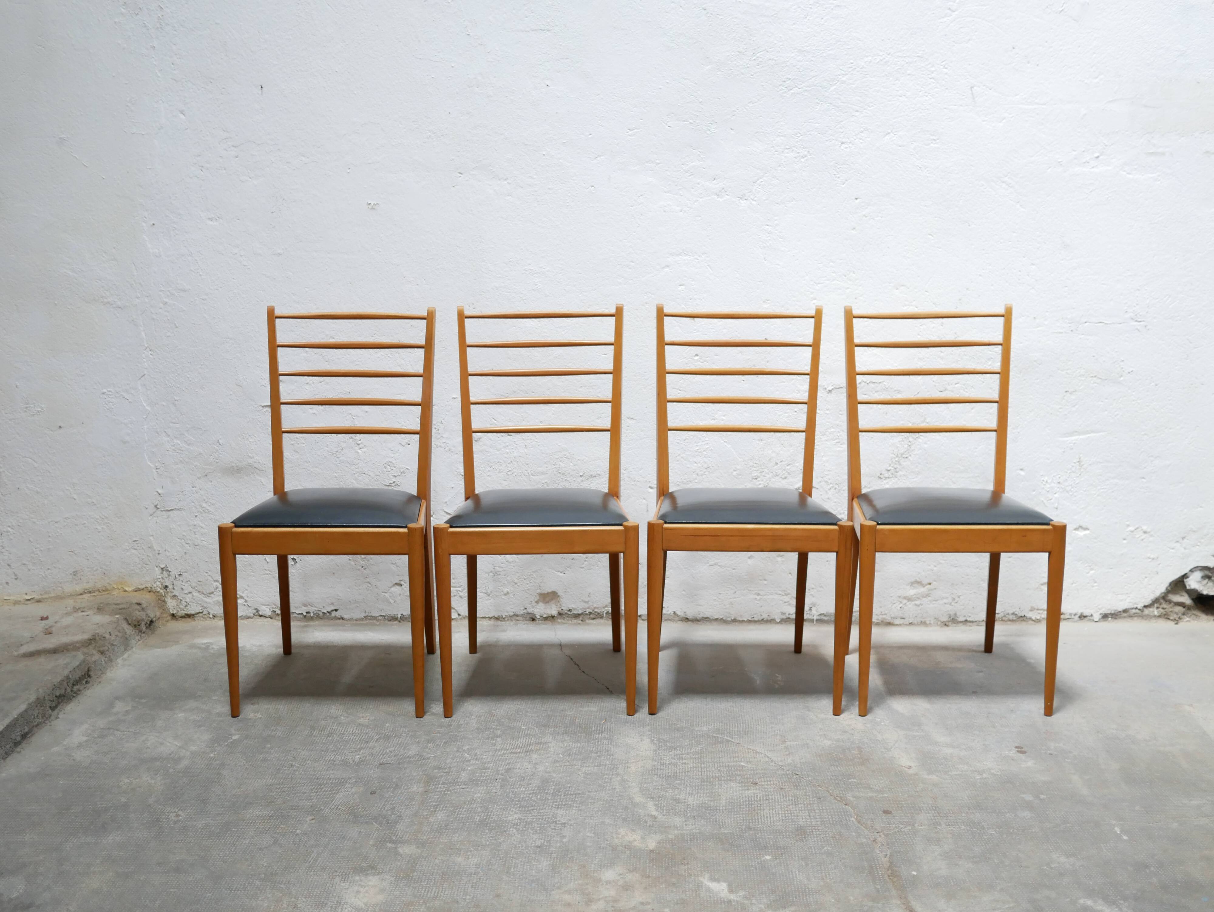Series of 4 vintage chairs in wood and skaï