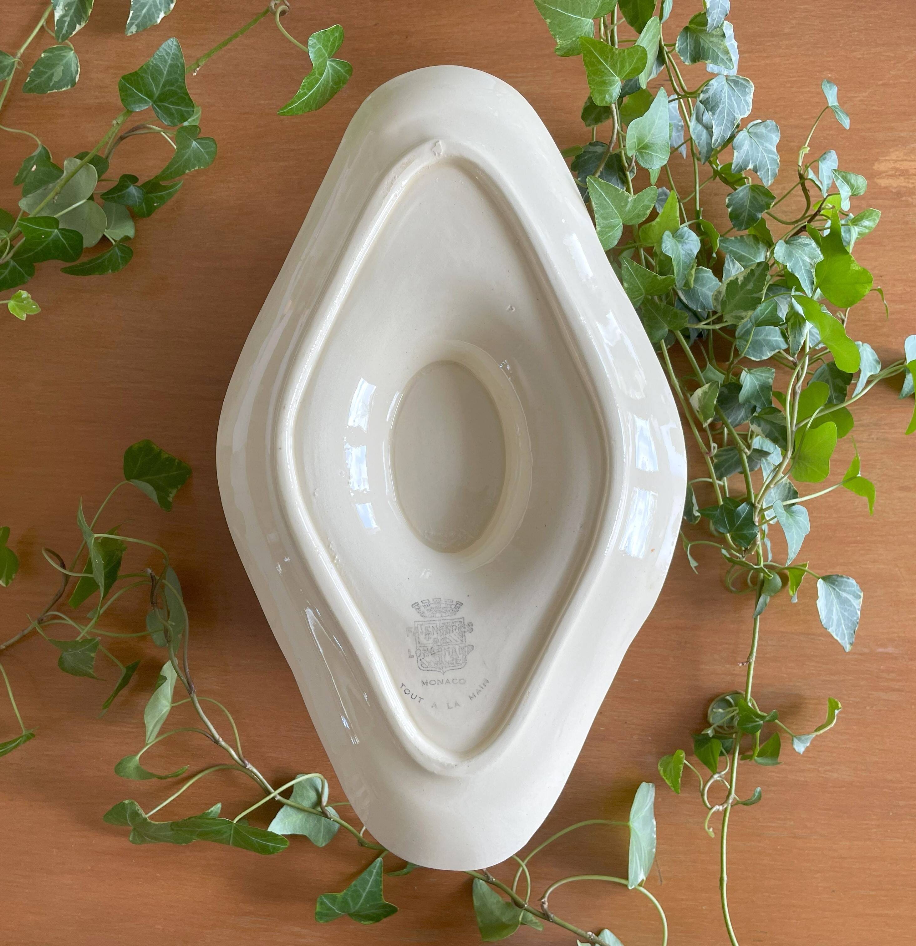 Large antique sauceboat in Longchamp earthenware.