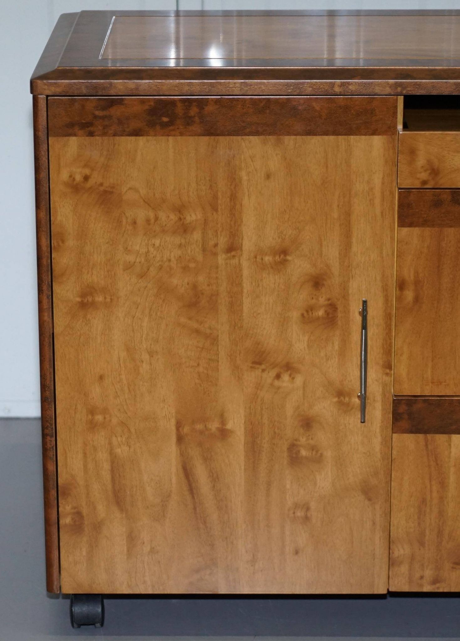 Walnut Burr buffet with drawers and wheels, part of a set.