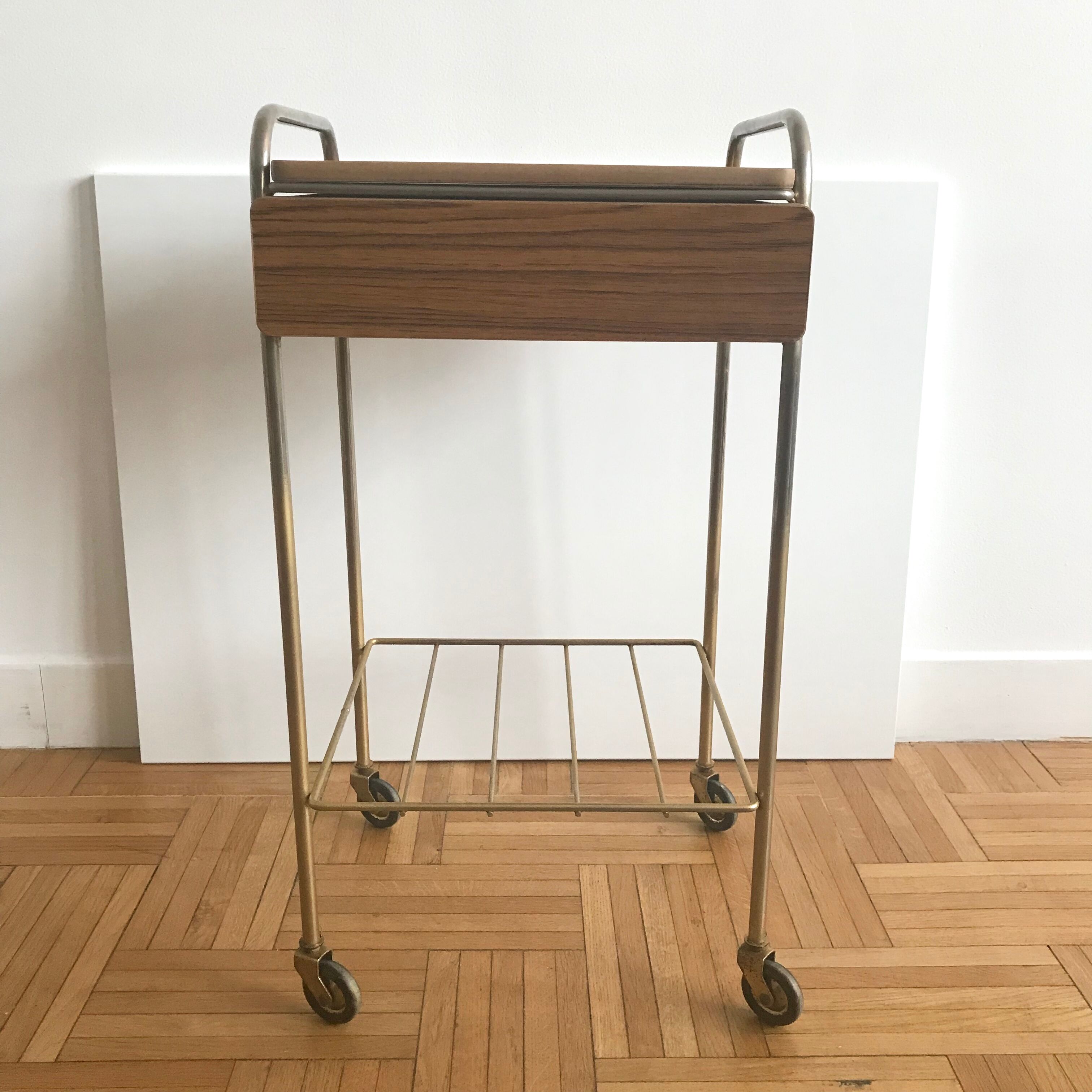 Serving bedside in gold metal and formica