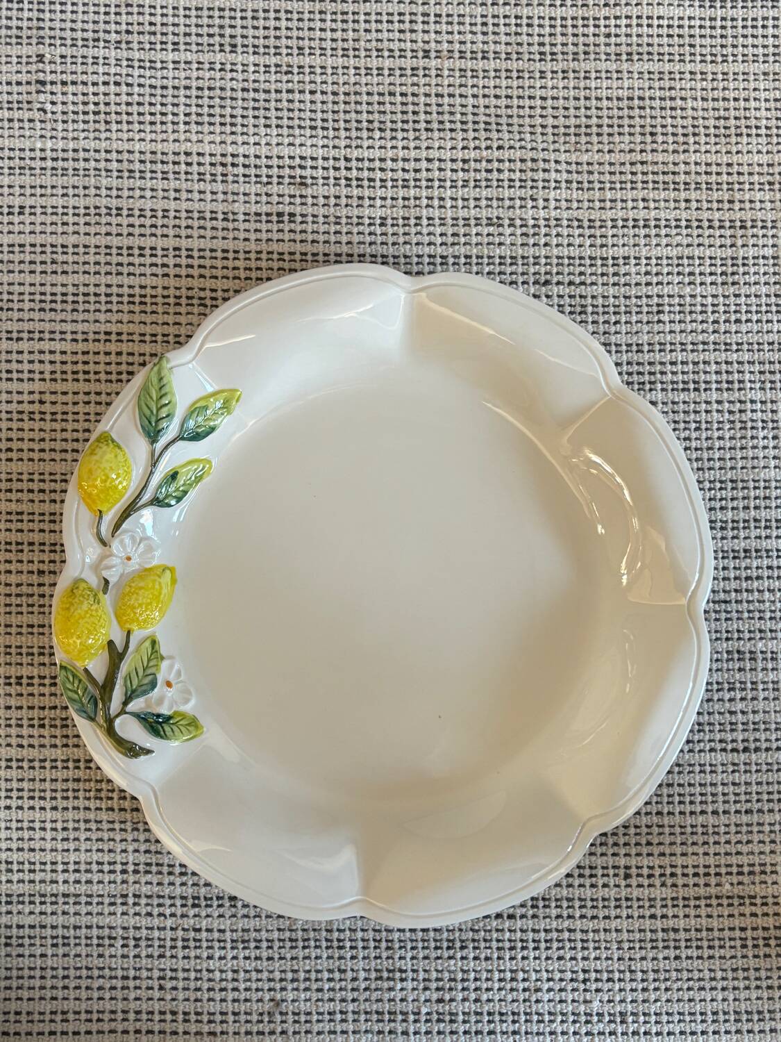 Plate and colander of lemons in slipware