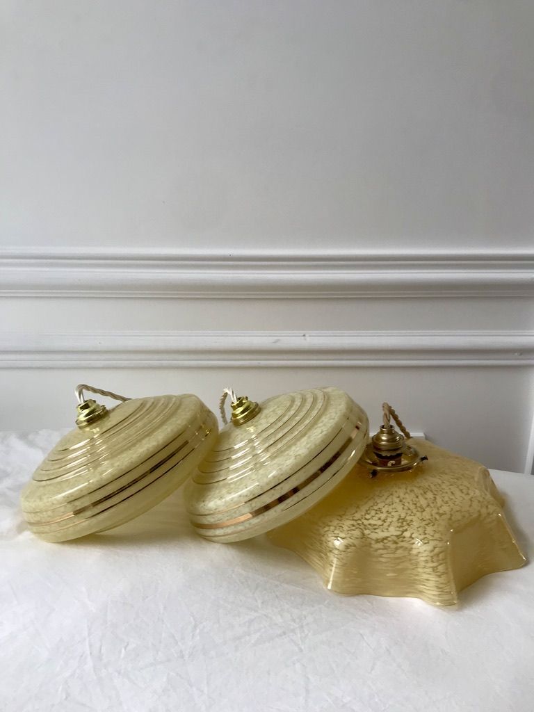 Pair of suspensions in yellow Clichy glass and golden border 40s-50s