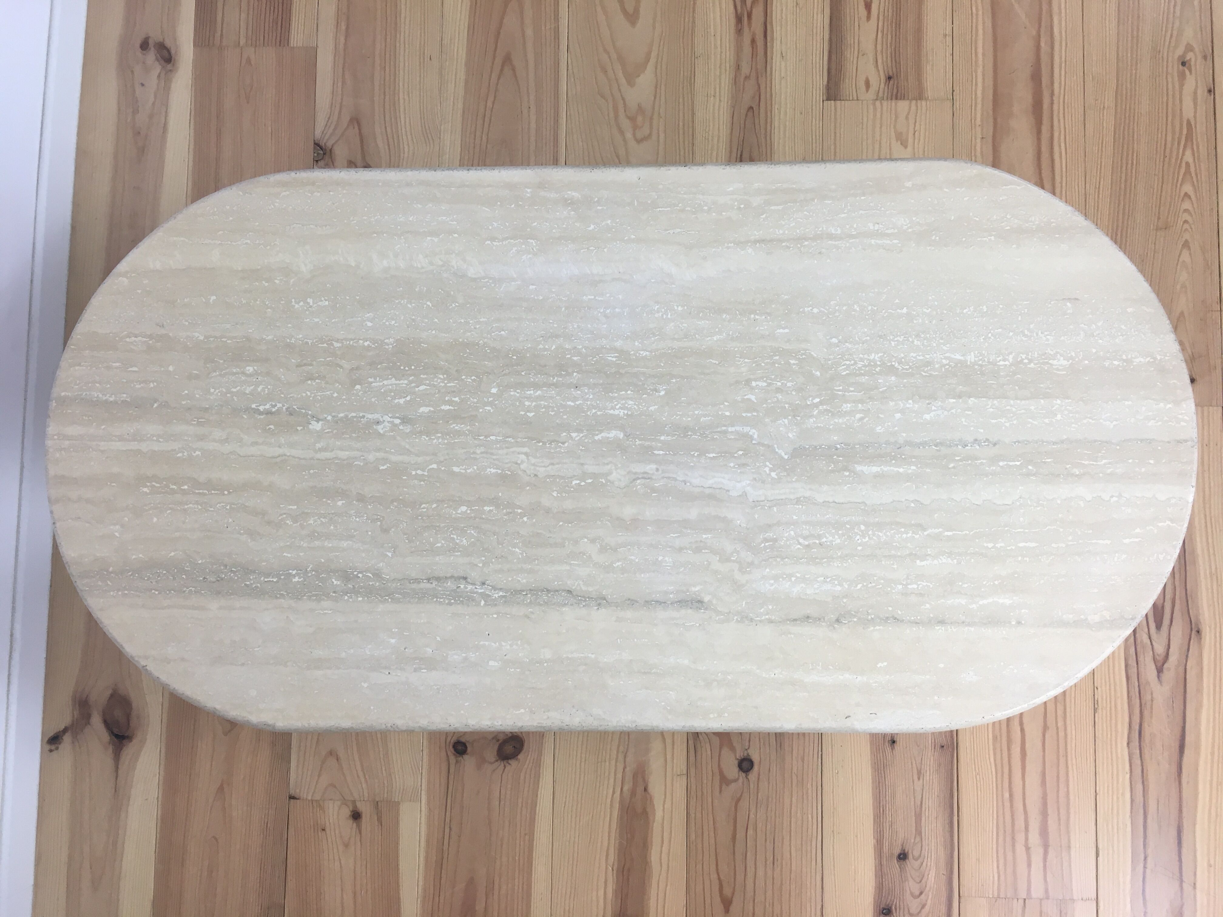 Oval coffee table in travertine