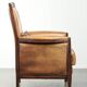 Cognac-coloured Art Deco design armchair made of sheepskin with a high back