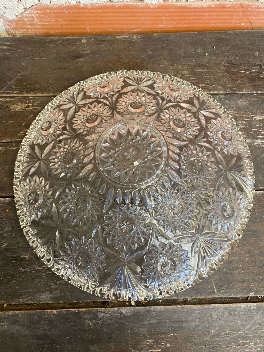 Cut glass fruit bowl with carved star decoration.