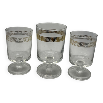 3 golden engraved glasses