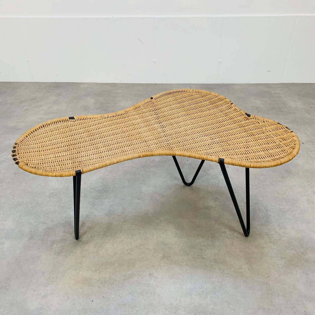 Raoul Guys coffee table, free form, wicker and metal, 1960s.