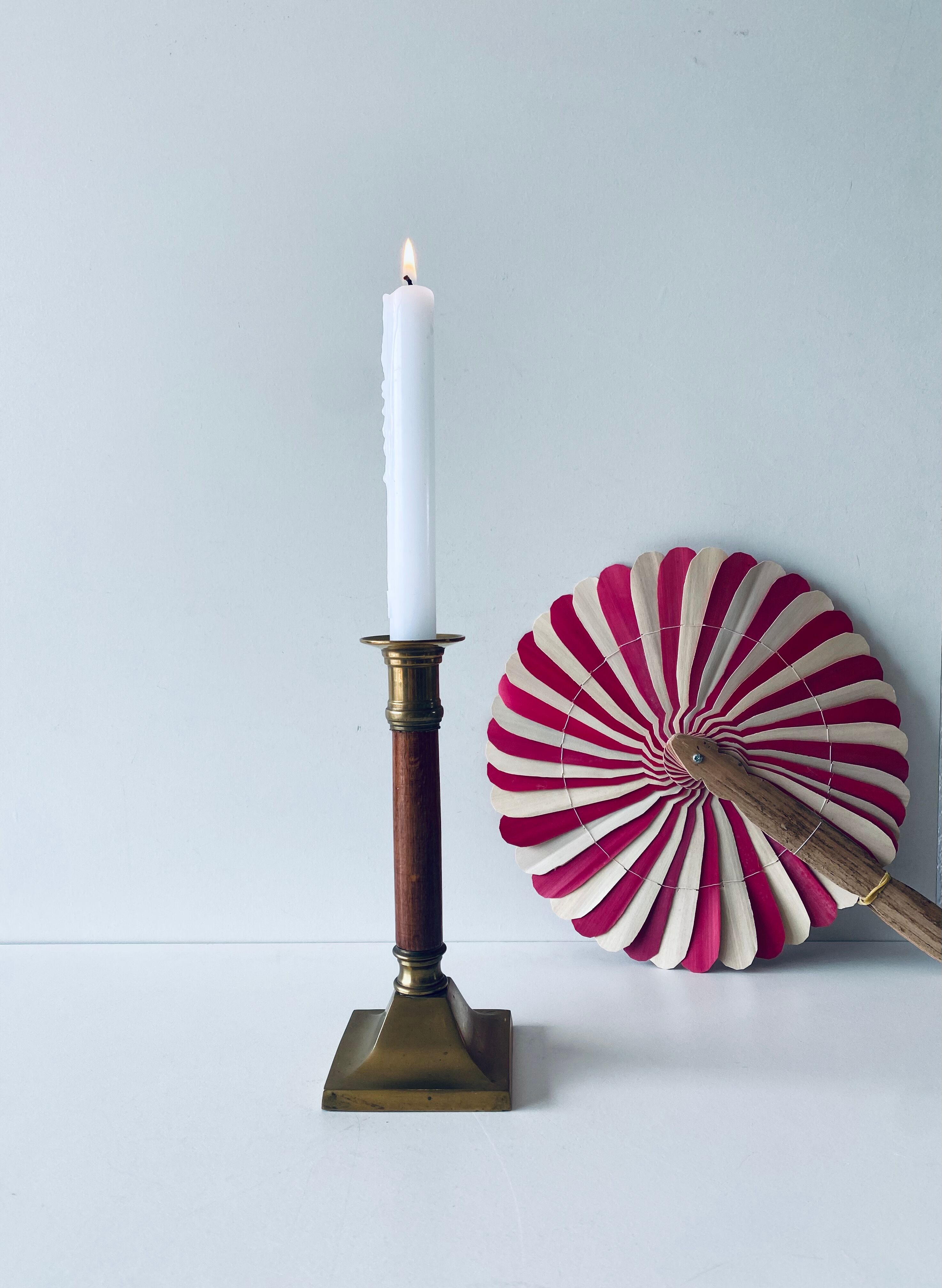 Old candle holder in brass and wood