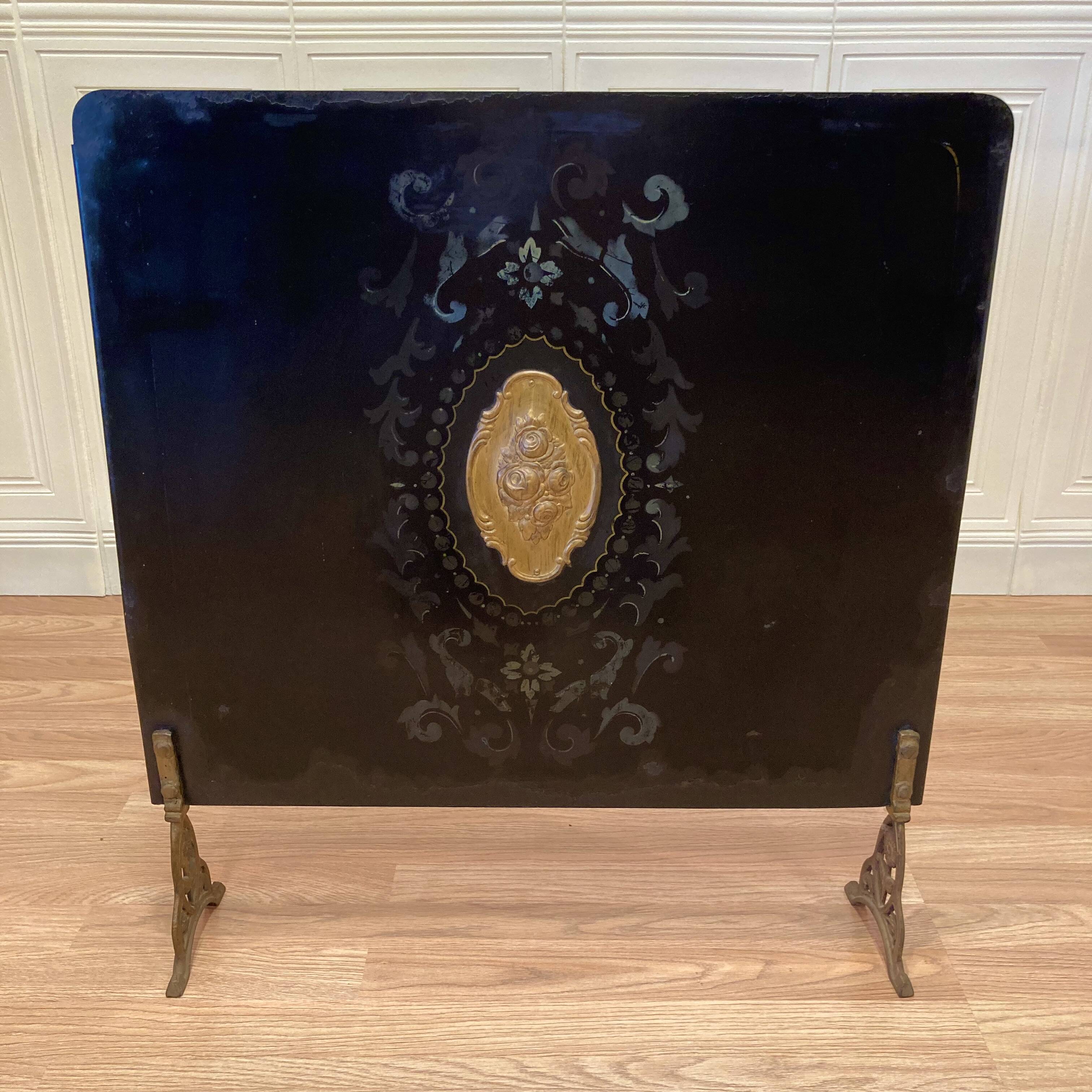 Antique metal fireplace screen.