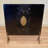 Antique metal fireplace screen.