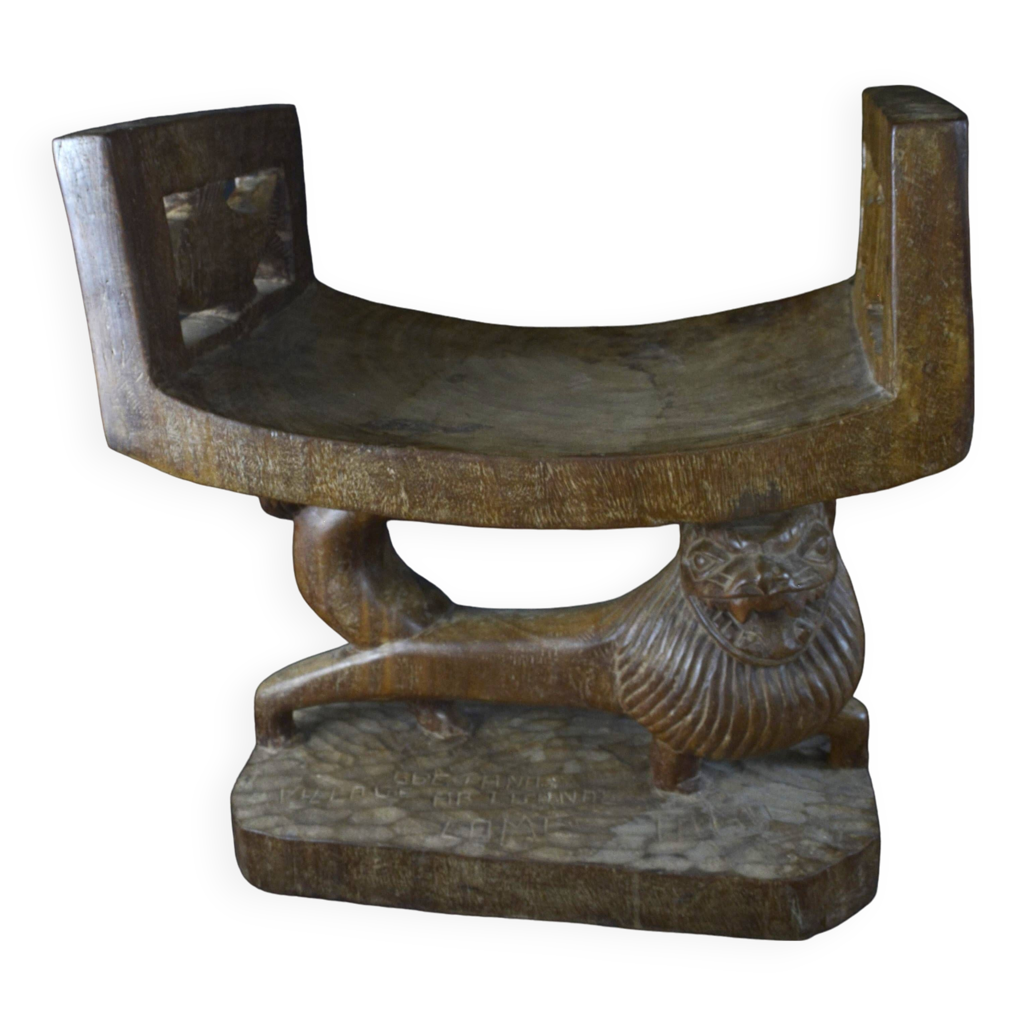 Togolese ethnic stool in carved exotic wood.