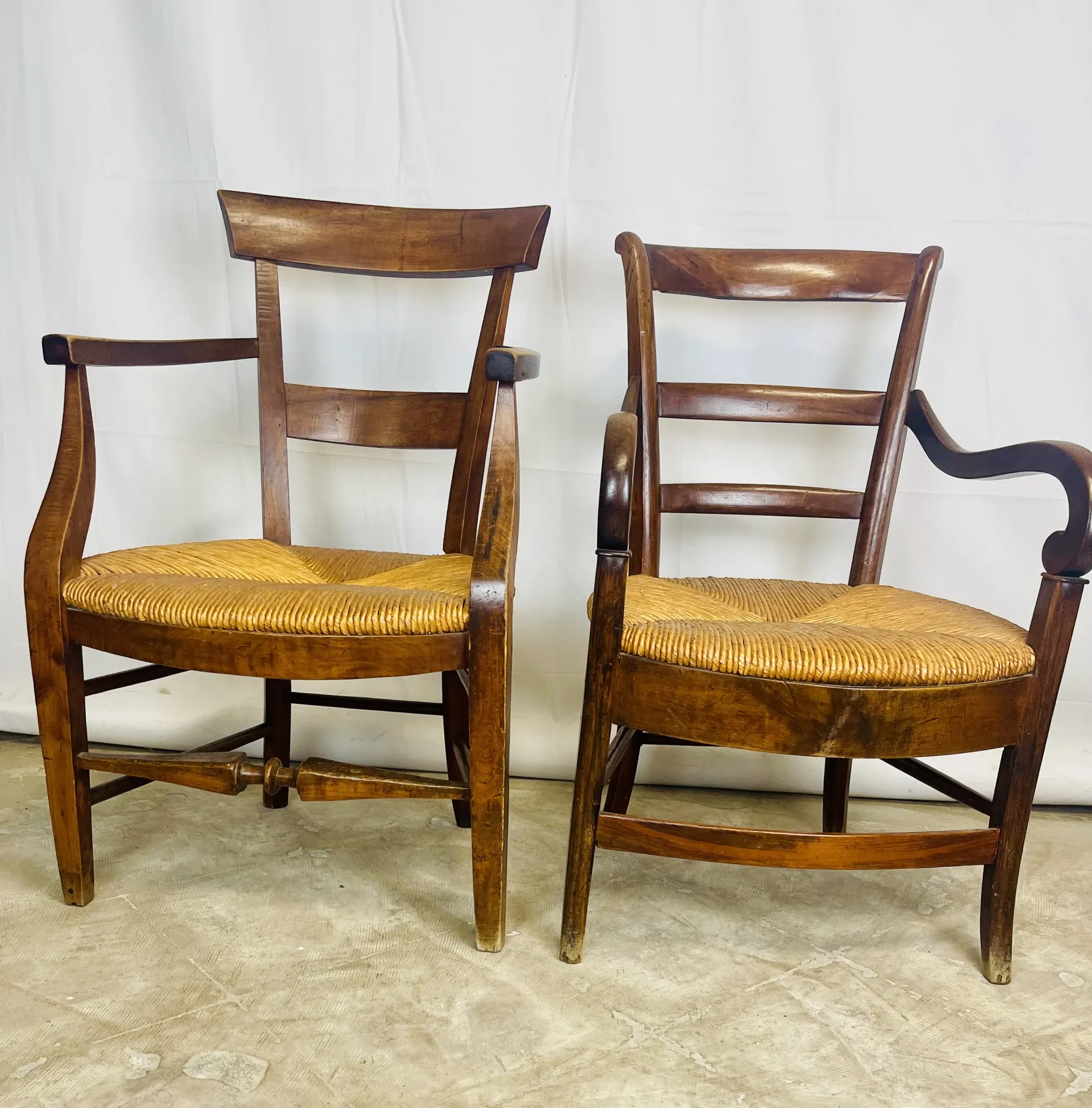 Pair of dissimilar walnut armchairs
