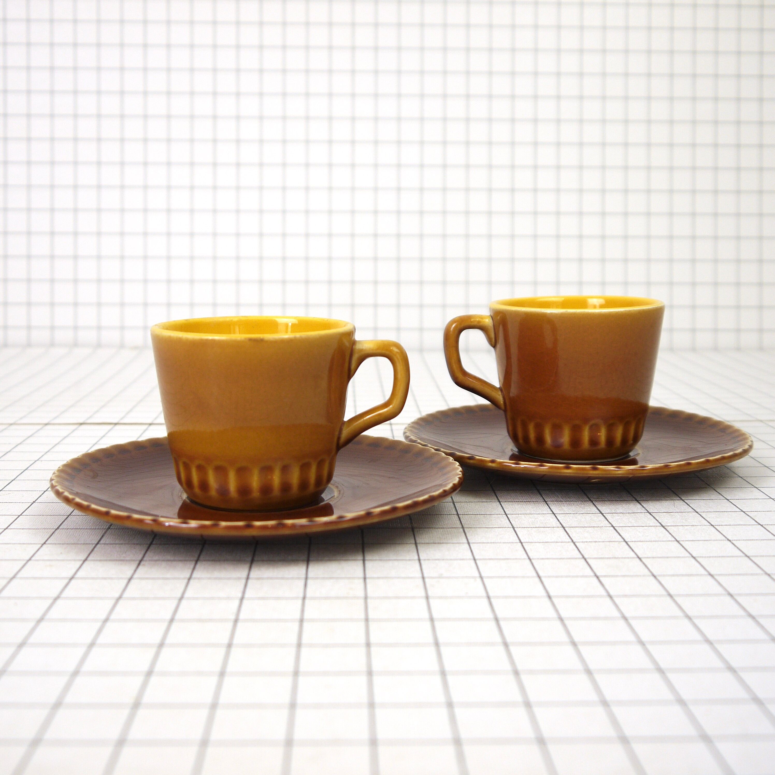 Two Digoin cups and saucers