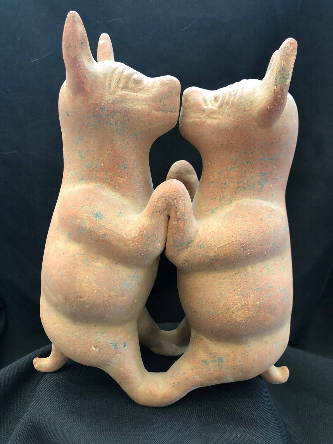 Pre-columbian style terracotta sculpture dancing fat dogs from colima mexico culture