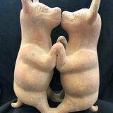 Pre-columbian style terracotta sculpture dancing fat dogs from colima mexico culture