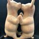 Pre-columbian style terracotta sculpture dancing fat dogs from colima mexico culture