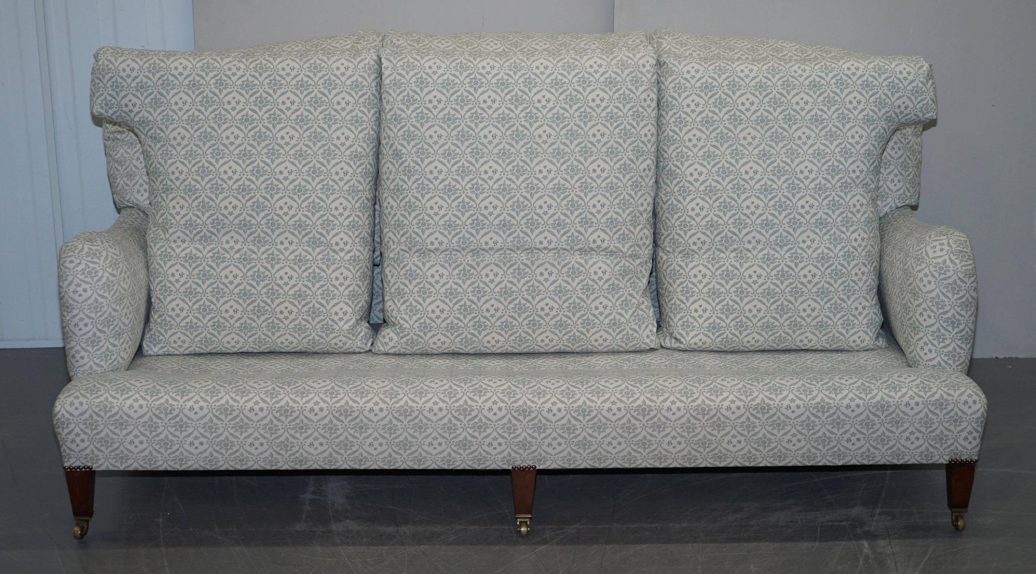 Howard & Sons canapé with feather cushions and ticking fabric, Victorian style.