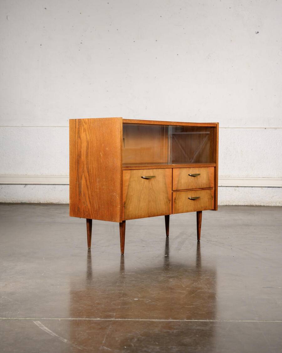 Old TV cabinet with brass handles.