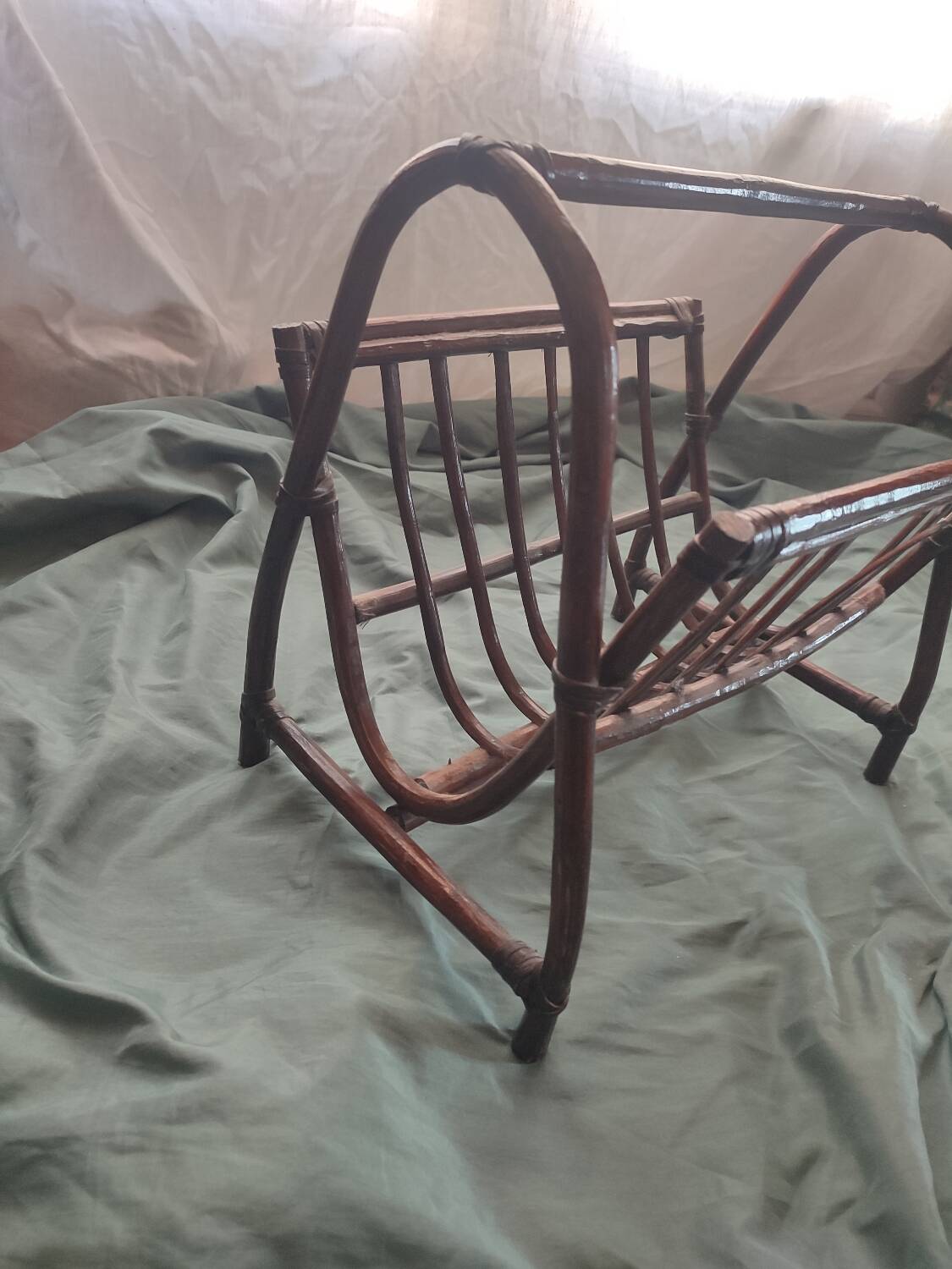 Dark rattan magazine rack